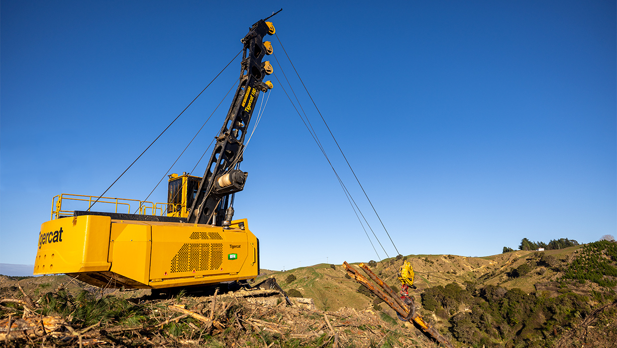 Tigercat 180 yarder moving logs uphill