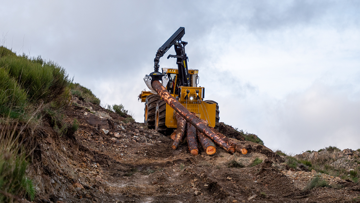 Image of a Tigercat 612 dual winch skidder working in the field