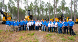 A group of Tigercat employees at a logging show