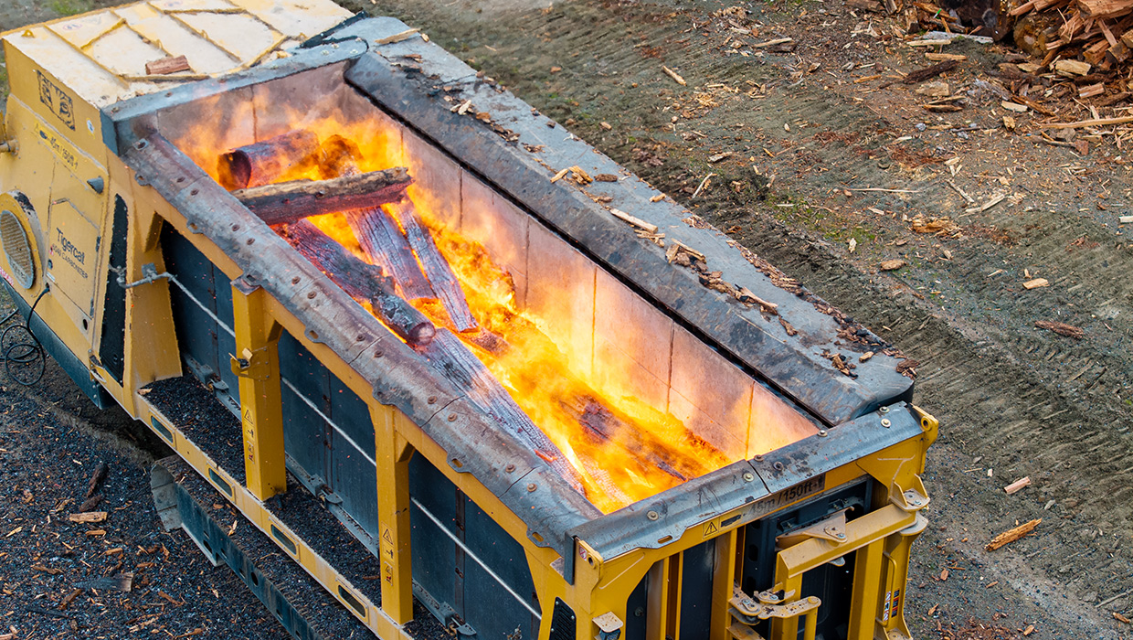 Image of a Tigercat 6040 carbonizer working in the field