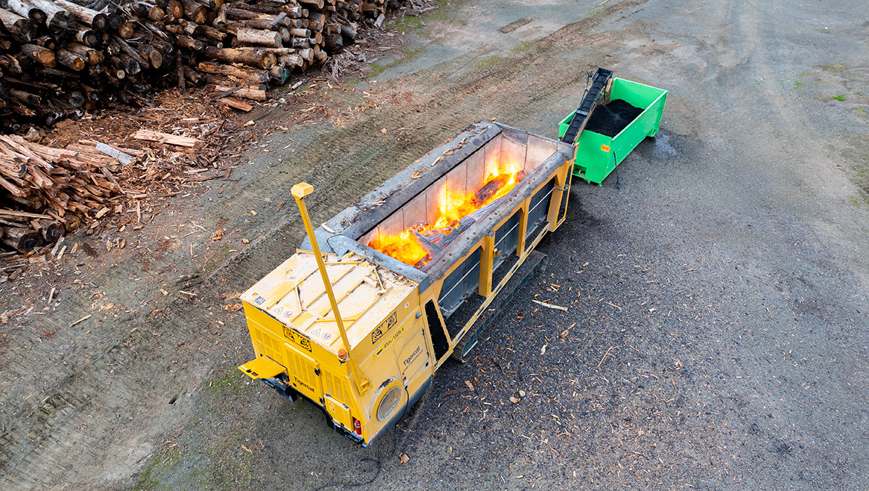 Image of a Tigercat 6040 carbonizer working in the field