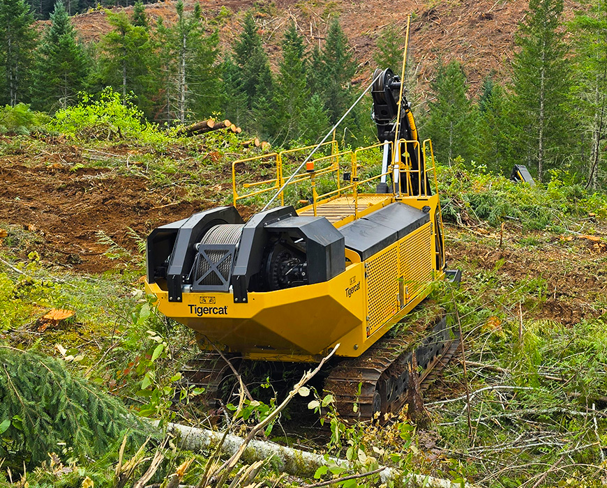 Image of a Tigercat 120 winch assist working in the field